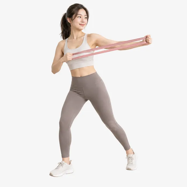 A woman doing a resistance-band workout