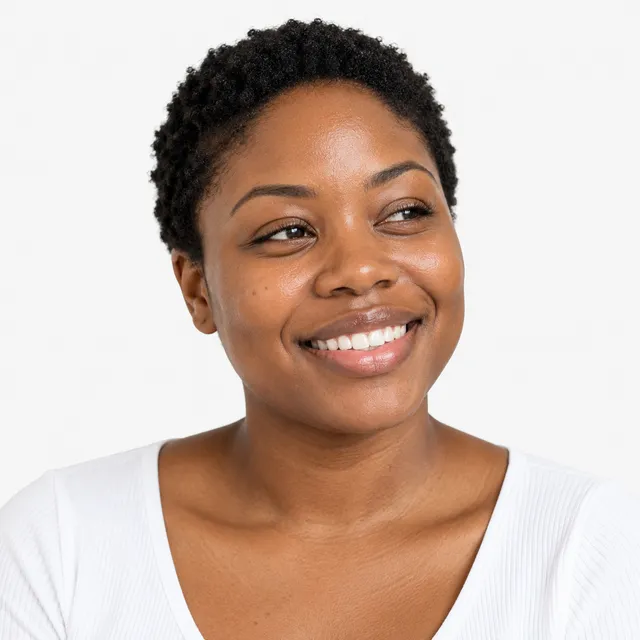 A smiling woman with short natural hair in a white top